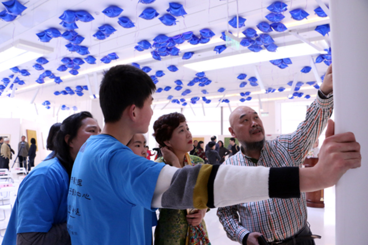 以画为媒，关爱自闭症少儿